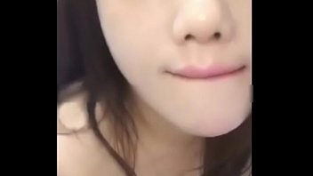 A Young Chinese Girl Performs An Intimate Act For The Camera