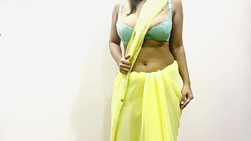 Sizzling Indian Bhabhi Flaunts Her Massive Melons In A Tight Yellow Saree, Teasing And Tempting With Every Move